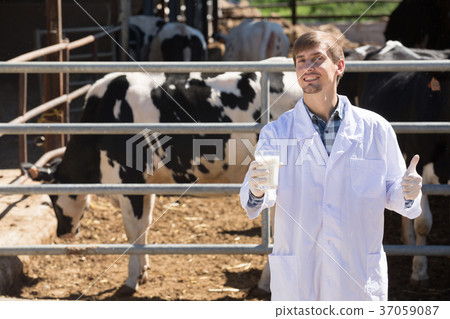 glad man veterinarian with milk 37059087