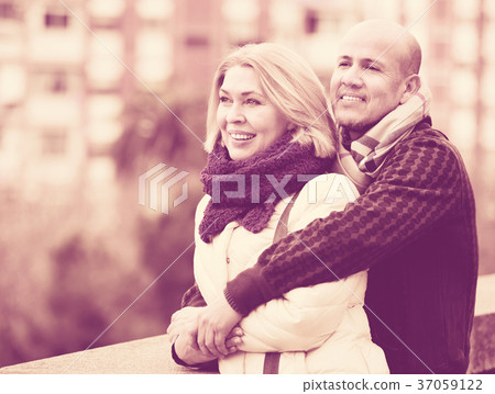 Portrait of positive glad mature couple in city Portrait of positive glad mature couple in city 37059122