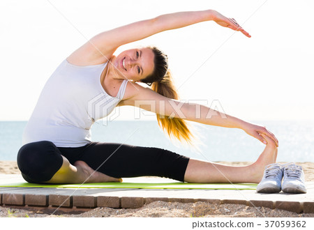 Woman doing yoga sitting 37059362
