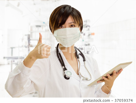 Asian female doctor with tablet computer, thumbs-up in clinic la Asian female doctor with tablet computer, thumbs-up in clinic la 37059374