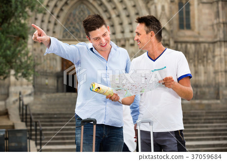 Guys couple looking at the map 37059684