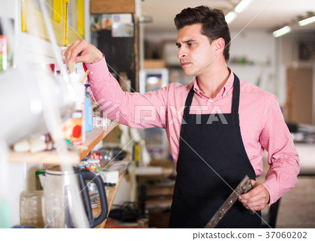 Carpenter standing in workshop 37060202