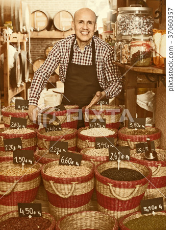 man selling dried beans man selling dried beans 37060357