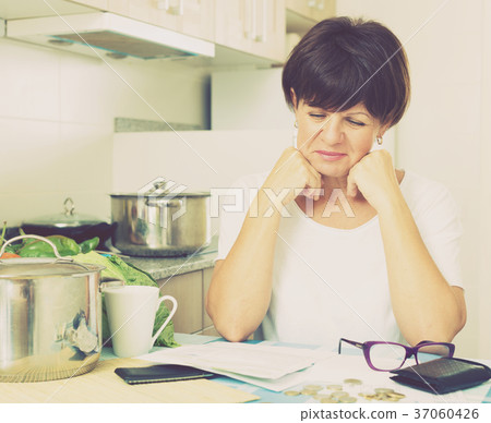 cheerful woman paying bills 37060426