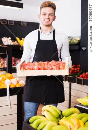 Male seller in grocery shop 37060487