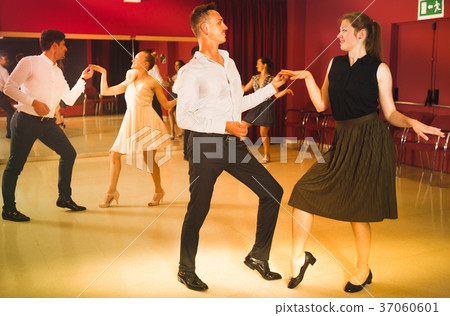 People practicing twist movements People practicing twist movements 37060601