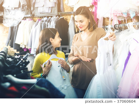 Family choosing dress in shop Family choosing dress in shop 37060604