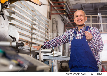 Professional worker in PVC shop. 37060683