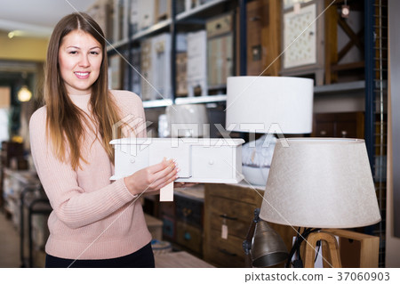 Woman choosing wooden box 37060903