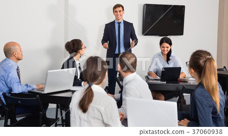 Employeesin office on business meeting Employeesin office on business meeting 37060938