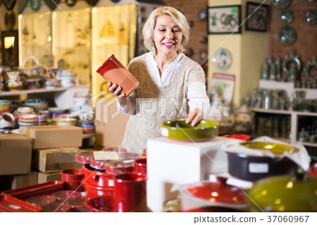 woman buying ceramic ware woman buying ceramic ware 37060967