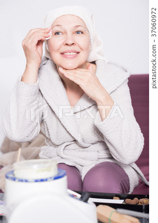 Woman cleaning face Woman cleaning face 37060972