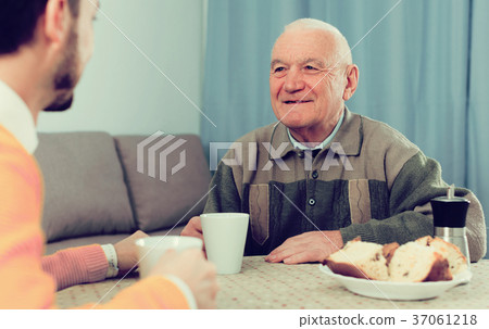 Elderly father and son breakfast Elderly father and son breakfast 37061218