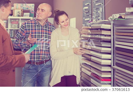 shop assistant working with happy customer in store shop assistant working with happy customer in store 37061613