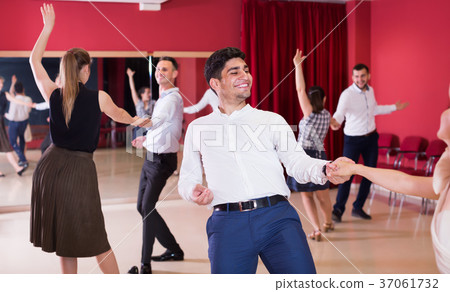 Glad group people dancing lindy hop in pairs 37061732