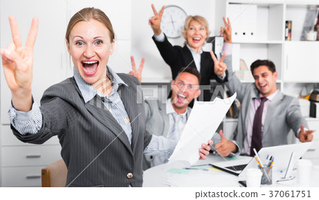 Happy business group with woman at office Happy business group with woman at office 37061751