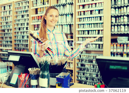 Female seller posing at counter 37062119