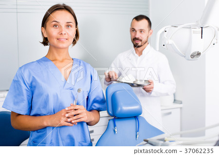 doctor with assistant are posing on workplace in hospital 37062235