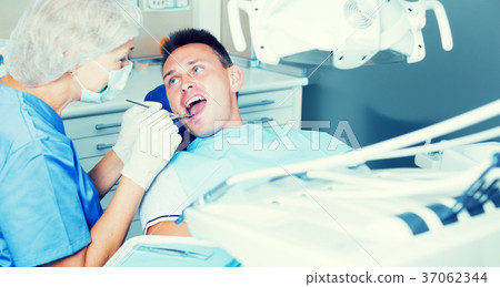 Young man visiting dentist 37062344