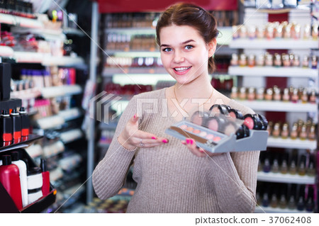 Girl seller is demonstrating blushes 37062408