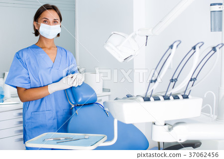 stomatologist is readying meet next client in dentist offic 37062456
