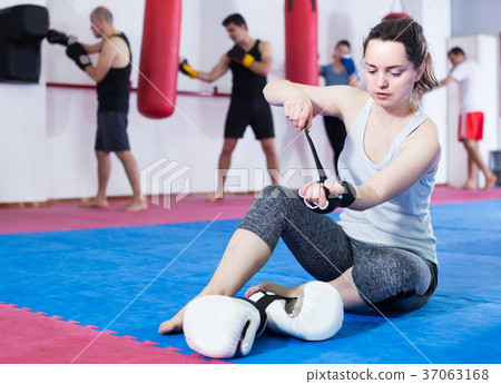Sportswoman on the floor is preparing for battle Sportswoman on the floor is preparing for battle 37063168