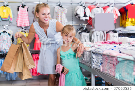 Mother with daughter holding packages 37063525