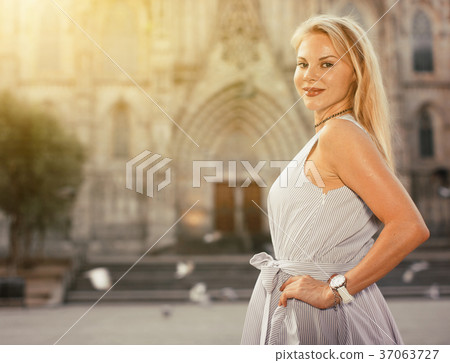 Adult female in the dress at the street Adult female in the dress at the street 37063727
