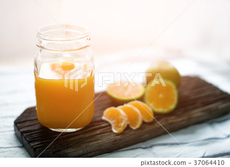 orange juice with blurry background orange juice with blurry background 37064410