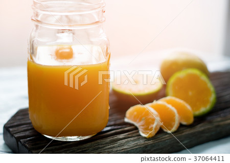 orange juice with blurry background orange juice with blurry background 37064411