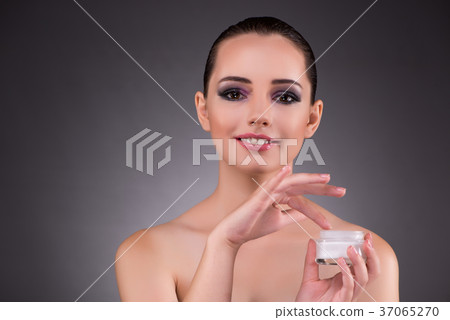 Woman applying cream in beauty concept 37065270