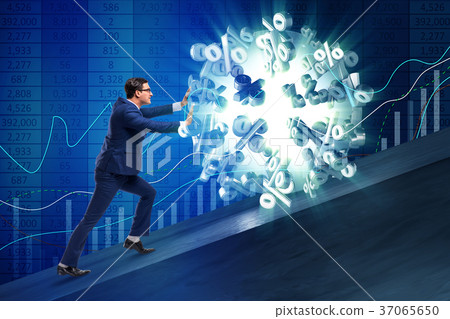 Businessman pushing away high interest rates Businessman pushing away high interest rates 37065650