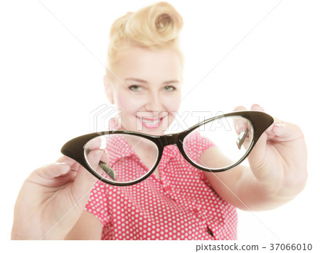 Blonde pin up girl holding retro glasses 37066010