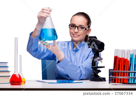 Lab chemist working with microscope and tubes Lab chemist working with microscope and tubes 37067334