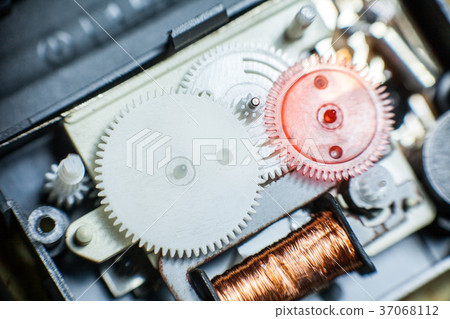 Closeup of plastic gears from clock works Closeup of plastic gears from clock works 37068112