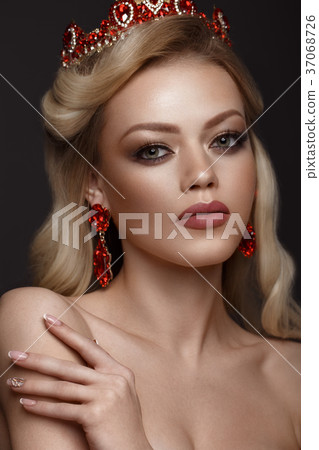 Beautiful blond girl with a golden crown, earrings 37068726