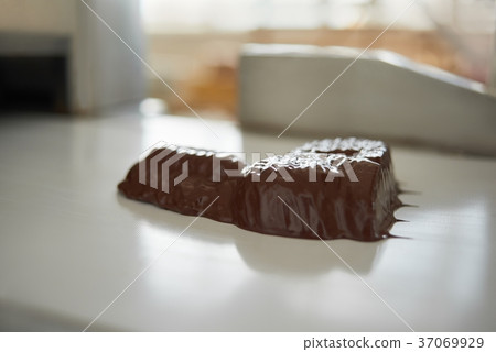 Little sweets in liquid chocolate Little sweets in liquid chocolate 37069929