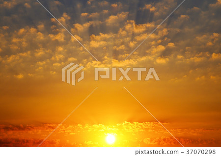 Cloudy sky and bright sunrise over the horizon. Cloudy sky and bright sunrise over the horizon. 37070298