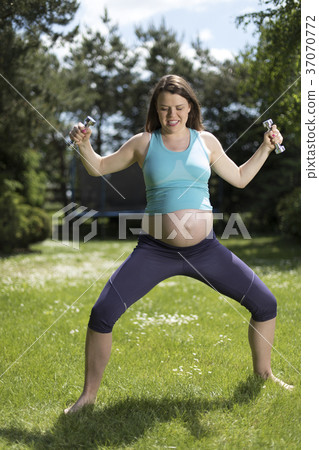 Pregnant woman with fitness Pregnant woman with fitness 37070772