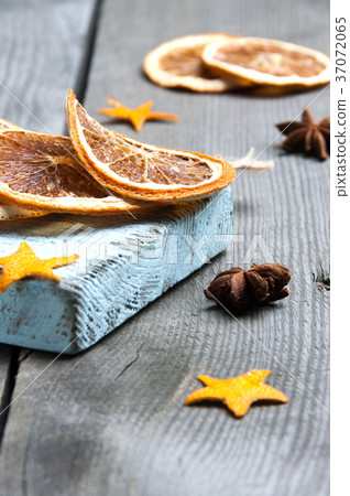 Dried orange on old wooden background 37072065