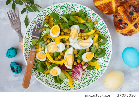 Spring Easter salad with chicken and quail eggs 37073056