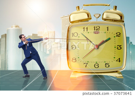 Businessman pulling clock in time management Businessman pulling clock in time management 37073641
