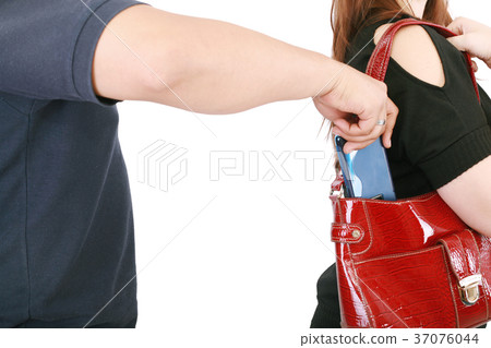 man pickpocketing a purse from woman's bag man pickpocketing a purse from woman's bag 37076044