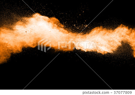 abstract orange powder explosion on black. abstract orange powder explosion on black. 37077809