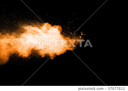 abstract orange powder explosion on black. abstract orange powder explosion on black. 37077812