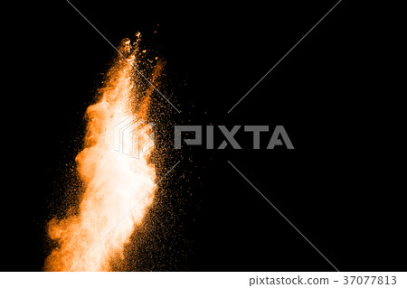 abstract orange powder explosion on black. abstract orange powder explosion on black. 37077813