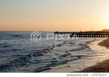Beach at dawn, piers perspective view 37079237