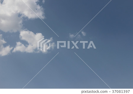 Clear blue daylight sky with white clouds and 37081397