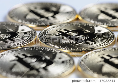 Macro view of shiny Bitcoin souvenire coins Macro view of shiny Bitcoin souvenire coins 37082243