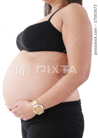 pregnant woman touching her belly with hands 37083673